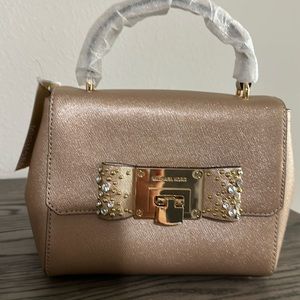 Tina Micheal Kors gold purse